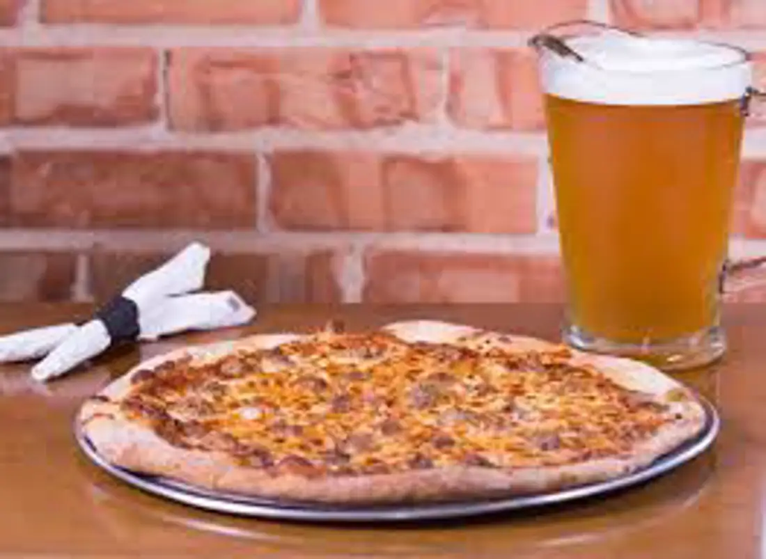 pizza and pitcher of beer